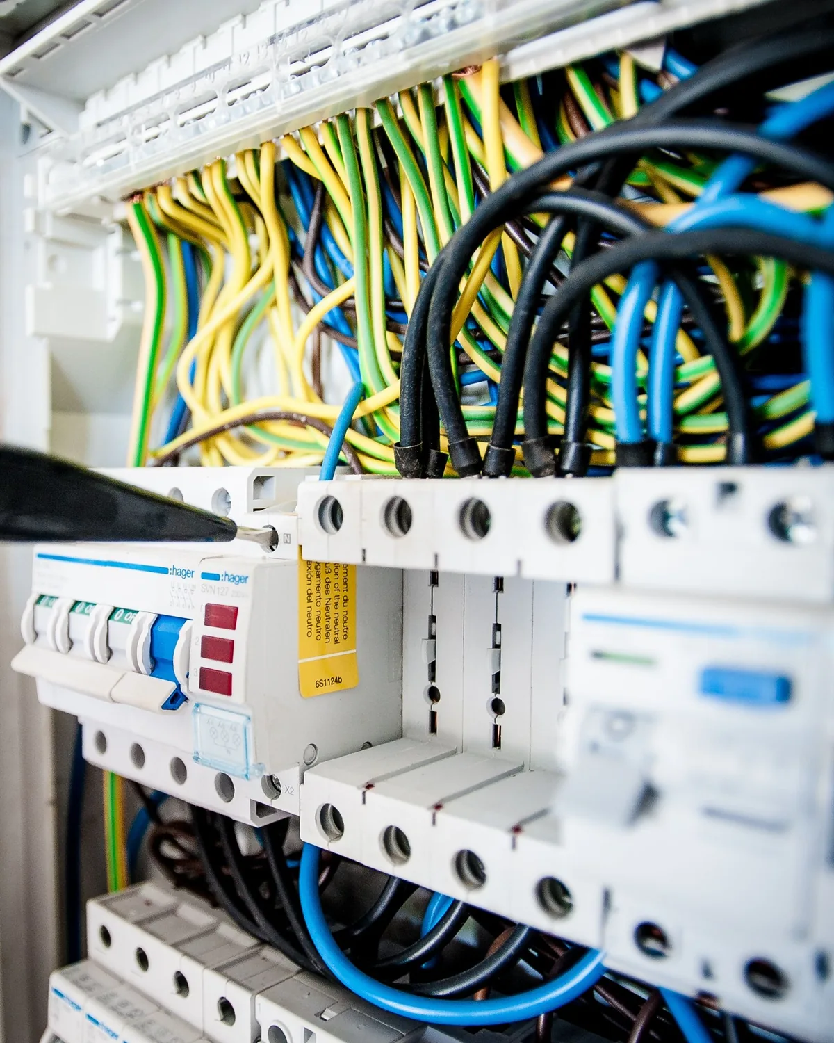 Electrician working on an electrical consumer unit