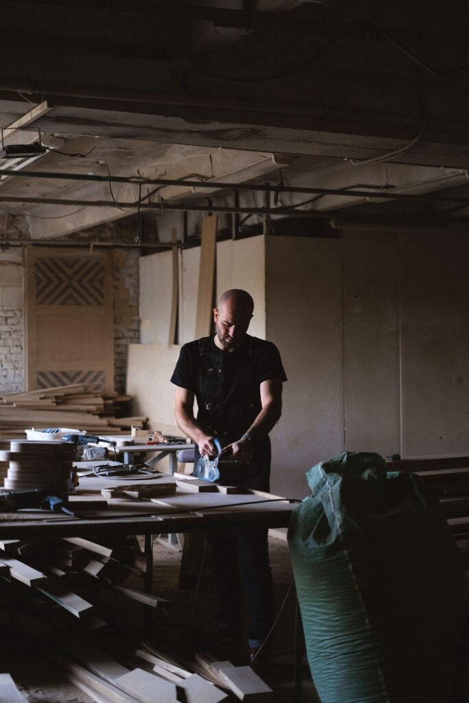 Carpenter working on timber in a joinery workshop